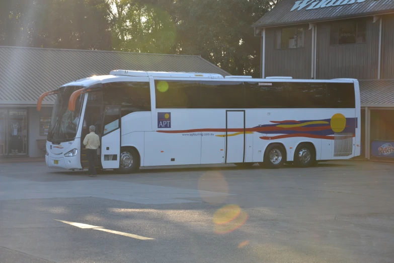 an airport bus parked in front of the building