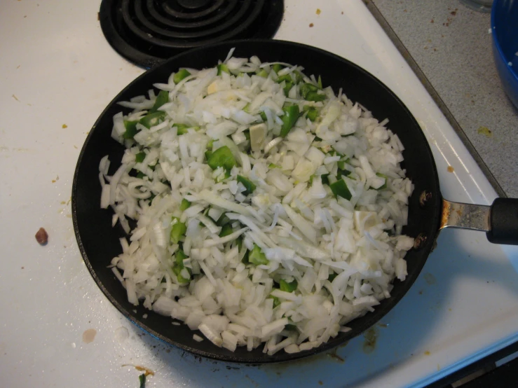 cooked food sitting in a pan on a stove