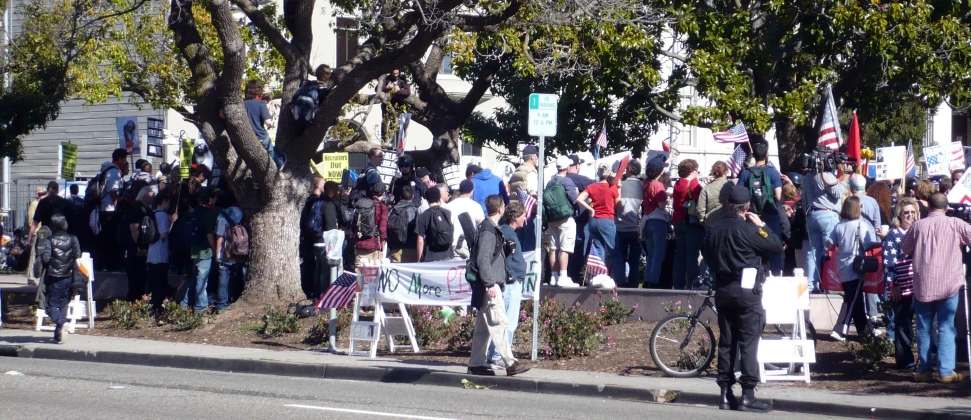 the crowd is gathered outside and waiting for the parade to begin