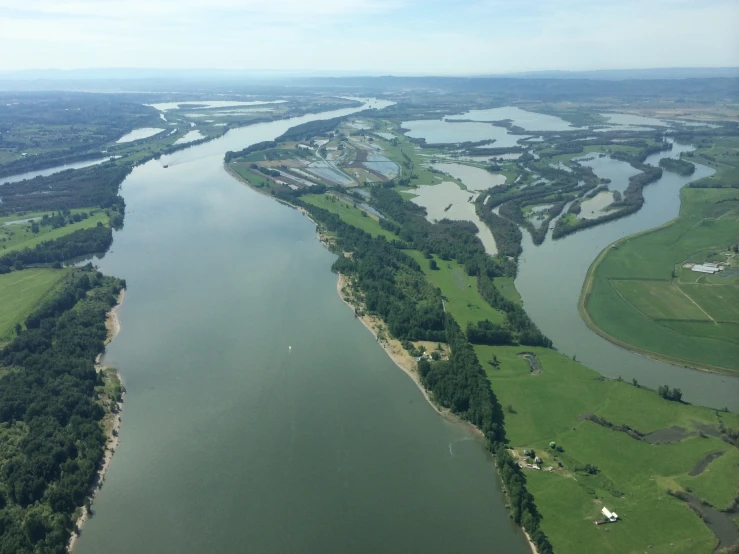 an aerial view of a river in the country