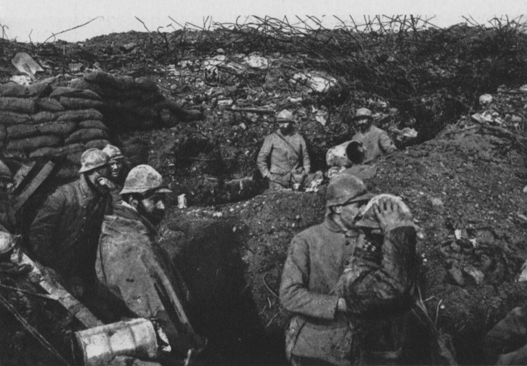 soldiers in a trench, with men walking by