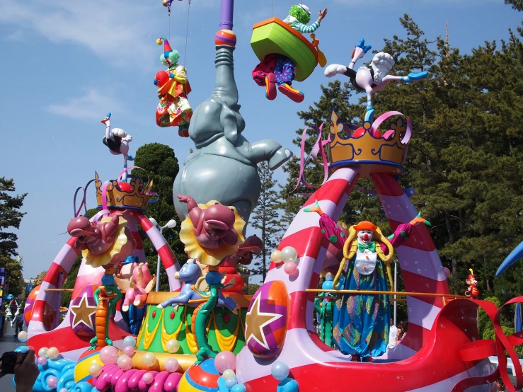 a float in the shape of cartoons riding a giant ship