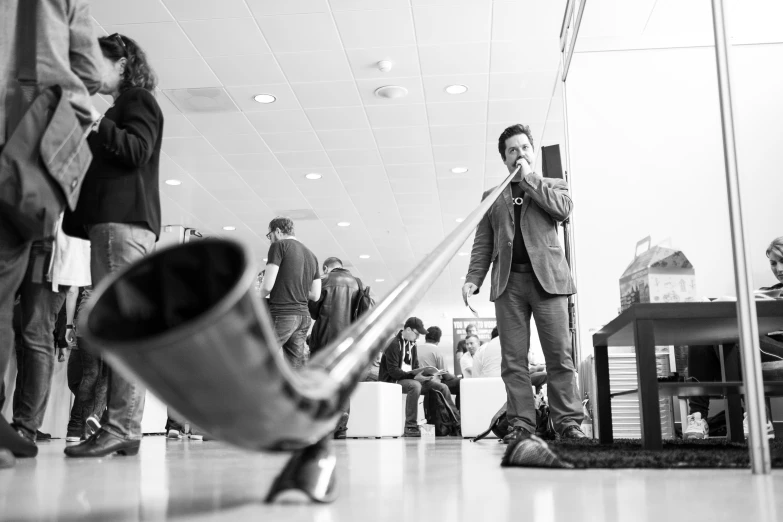 a man standing in front of an airport with a pole