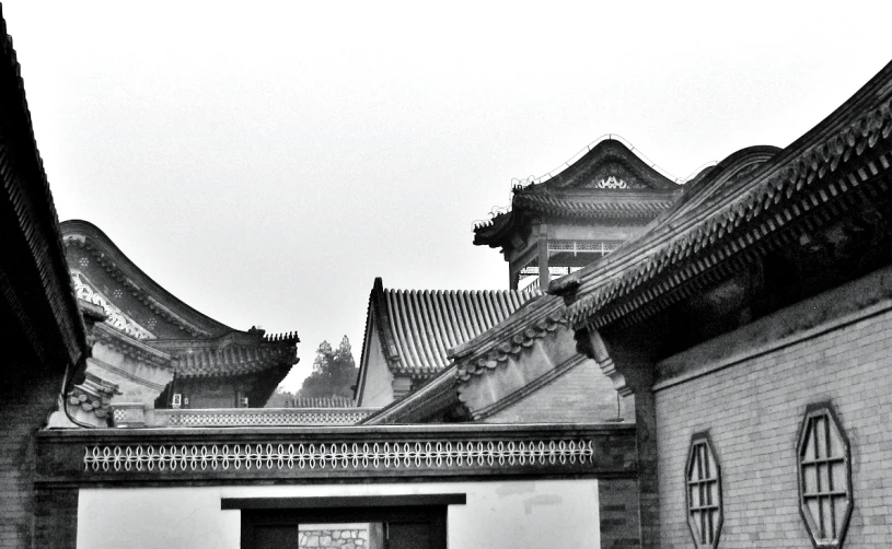 an old oriental building with stone walls and steeples