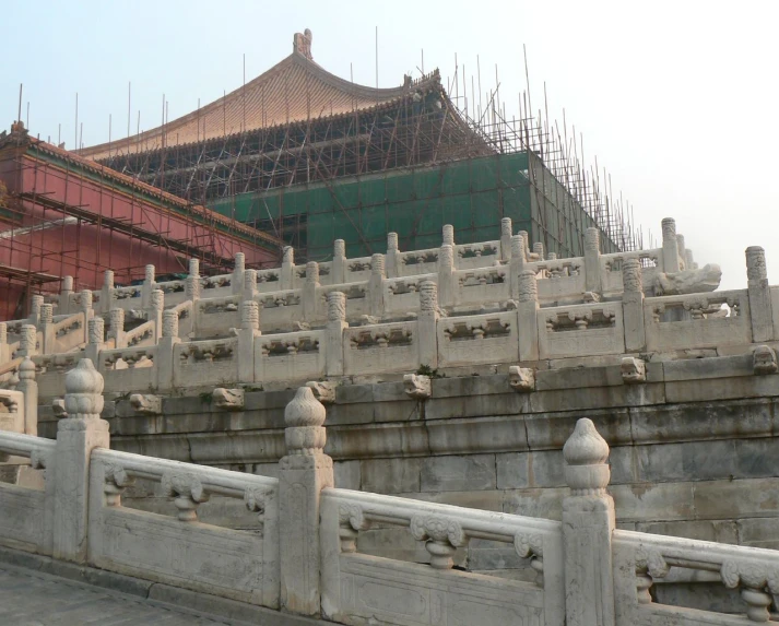 an old fenced in area near many large buildings