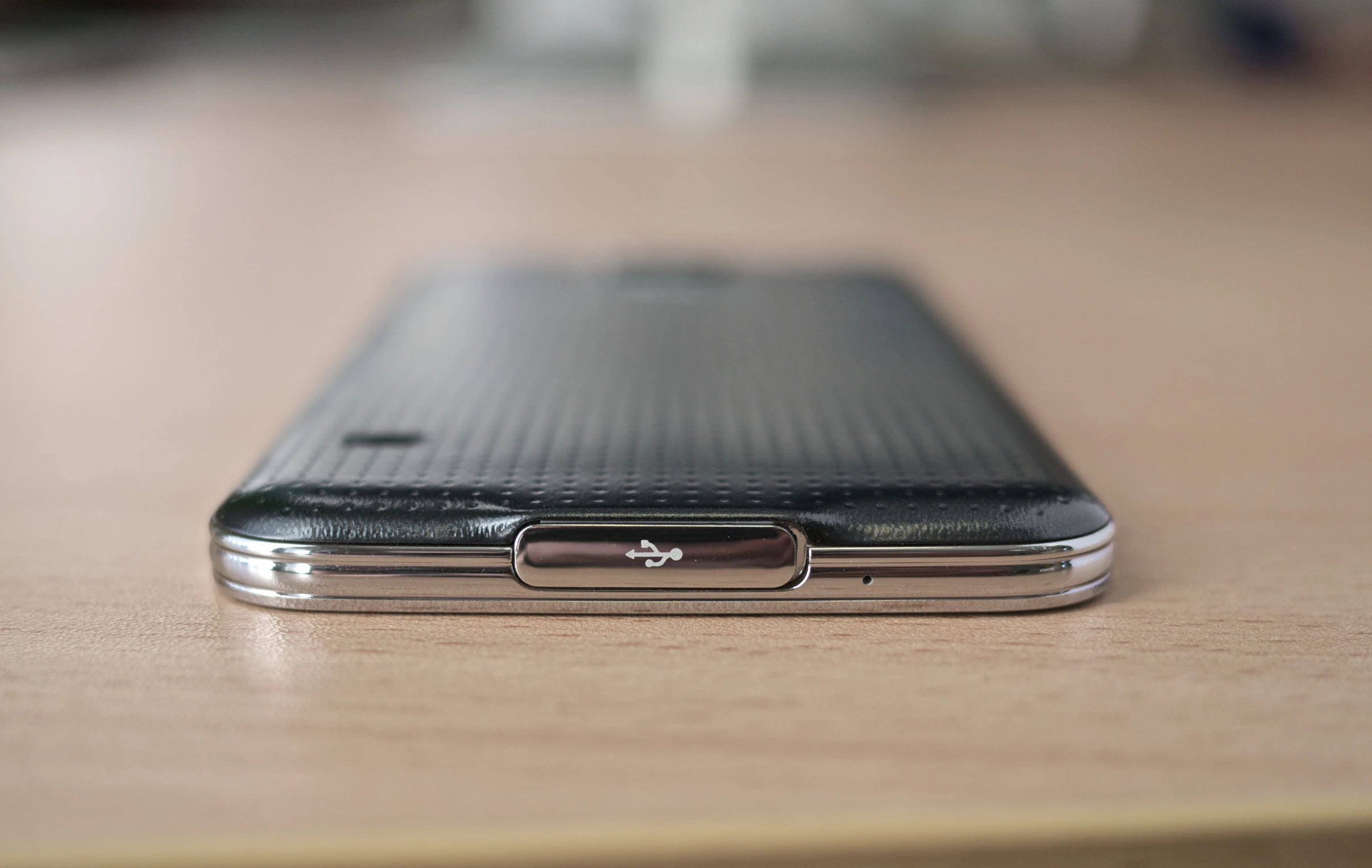 the back end of a cell phone sitting on top of a table