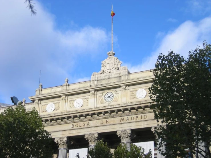 a building with clock built into it's sides