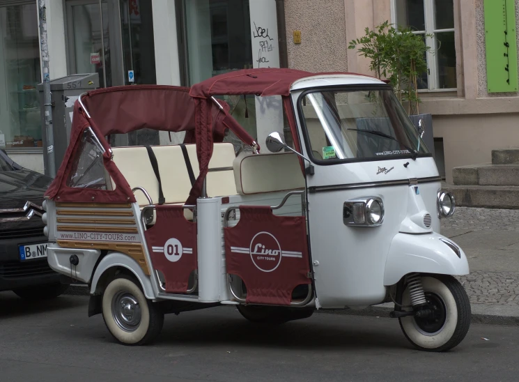 a motor scooter parked on the side of the road