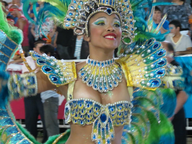 a woman wearing elaborate outfits at a show