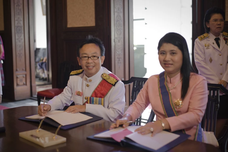 an image of two people wearing military garb