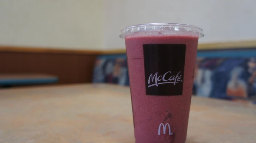 a cup with a beverage inside of it on the counter