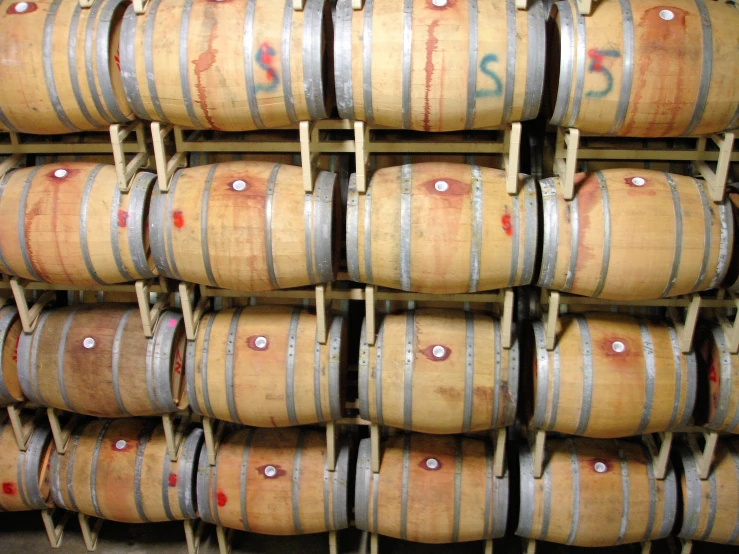 a stack of barrels are sitting in front of each other