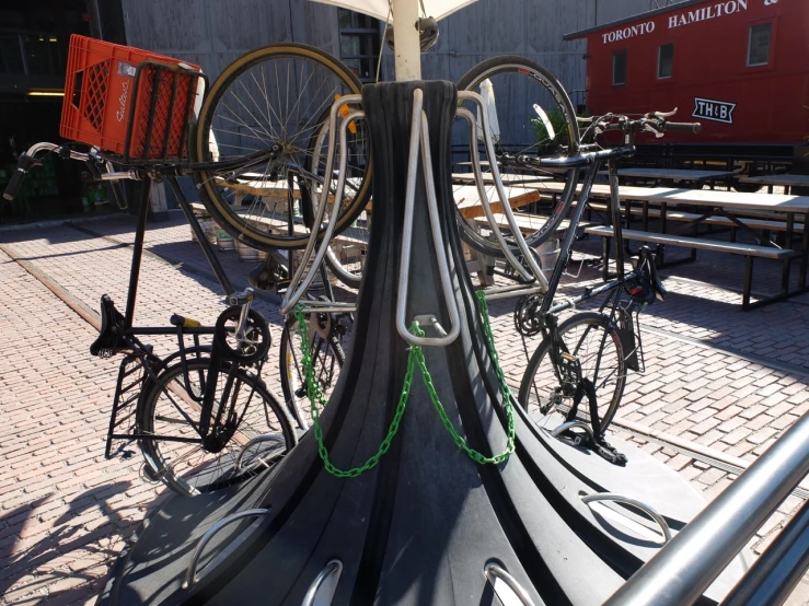several different kinds of bikes are on display at a city park