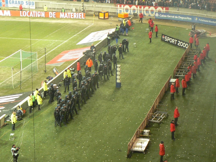 the teams of several teams are standing behind the benches