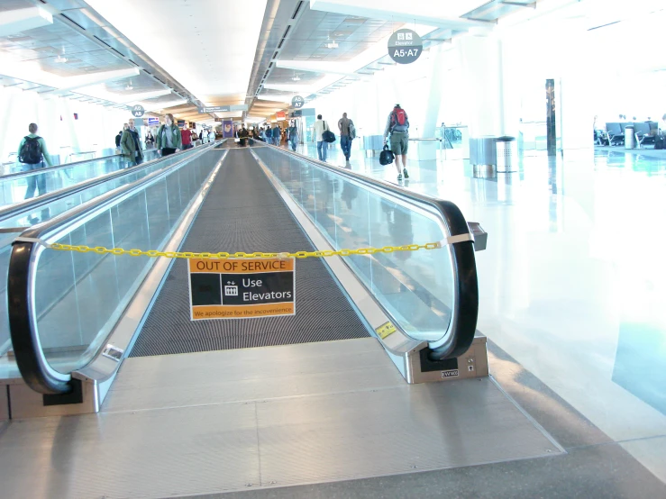 two escalators are located at an airport