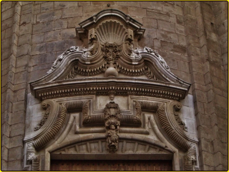 a stone building is decorated with sculptures and carvings