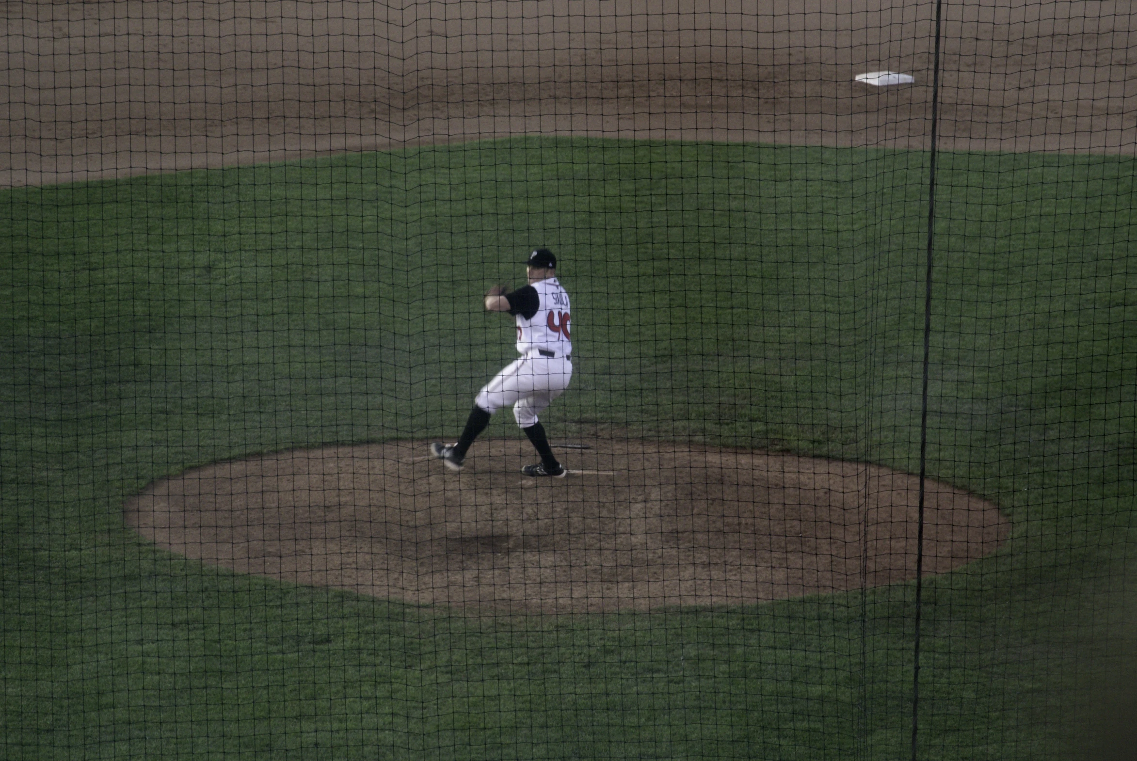 a pitcher throws the ball from the mound