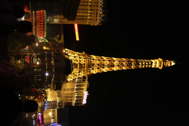 the eiffel tower lights up in all the different colors