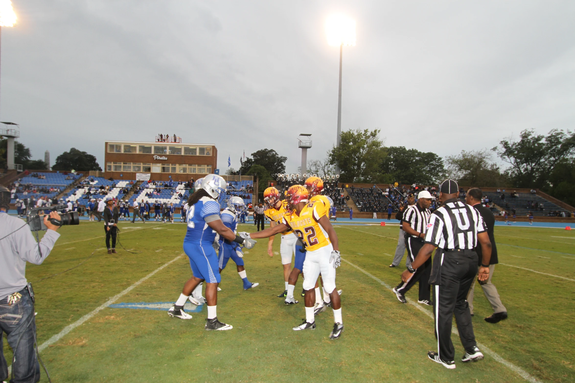 two opposing teams running on the field during a game