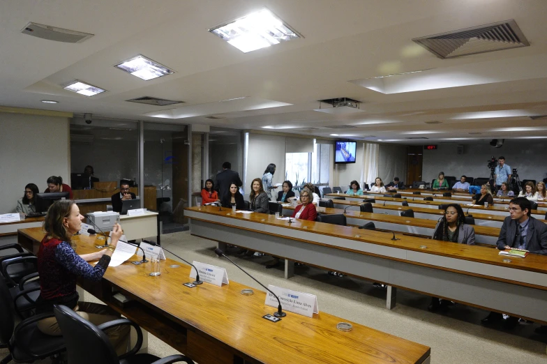 a group of people in lecture hall at various stages