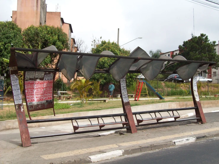 a large metal structure with several pieces of artwork on it