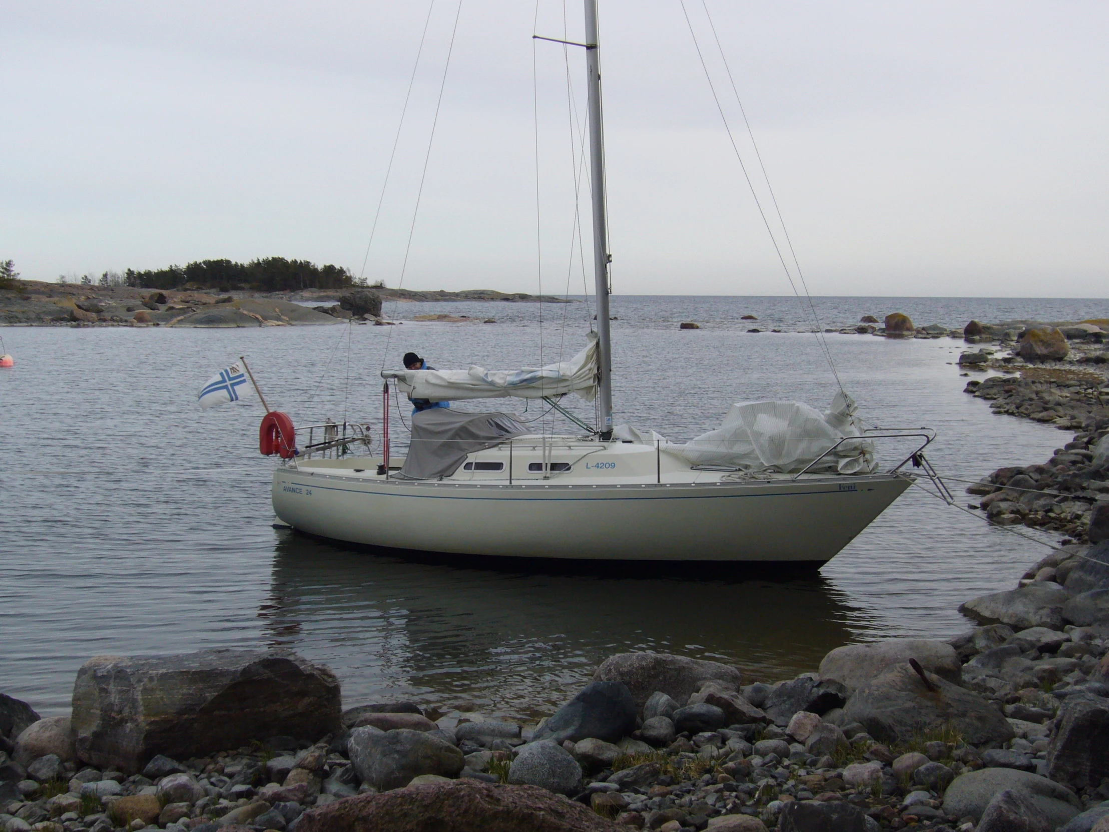 the sail boat has a flag on it