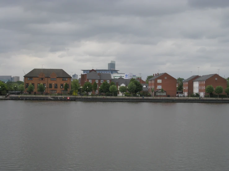 a view of buildings that are by the water