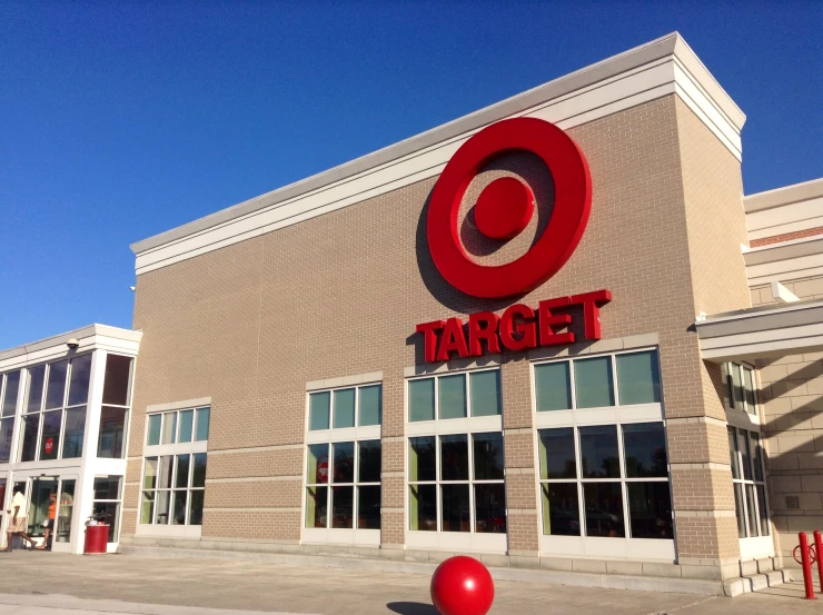 a target store on a brick building with a red balloon next to it