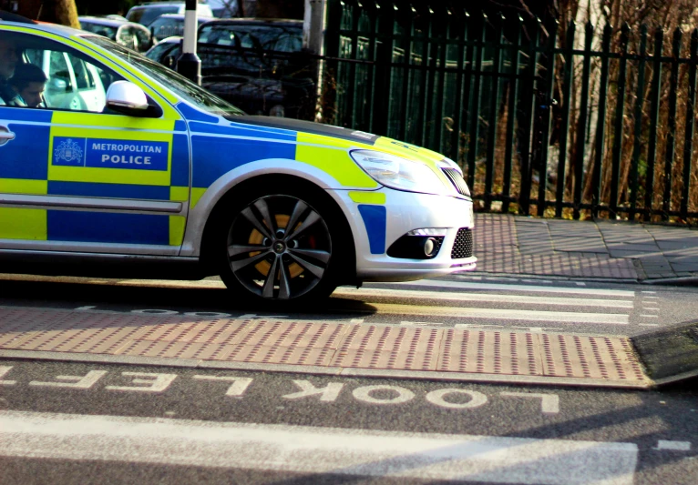 a car that is on the street with stripes