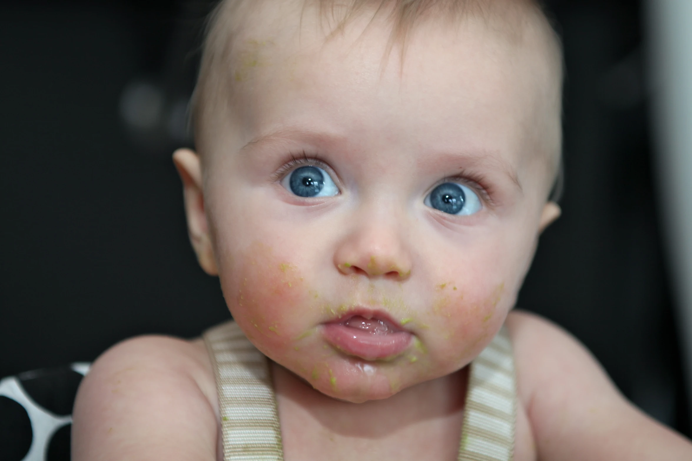 a young baby that is looking at the camera