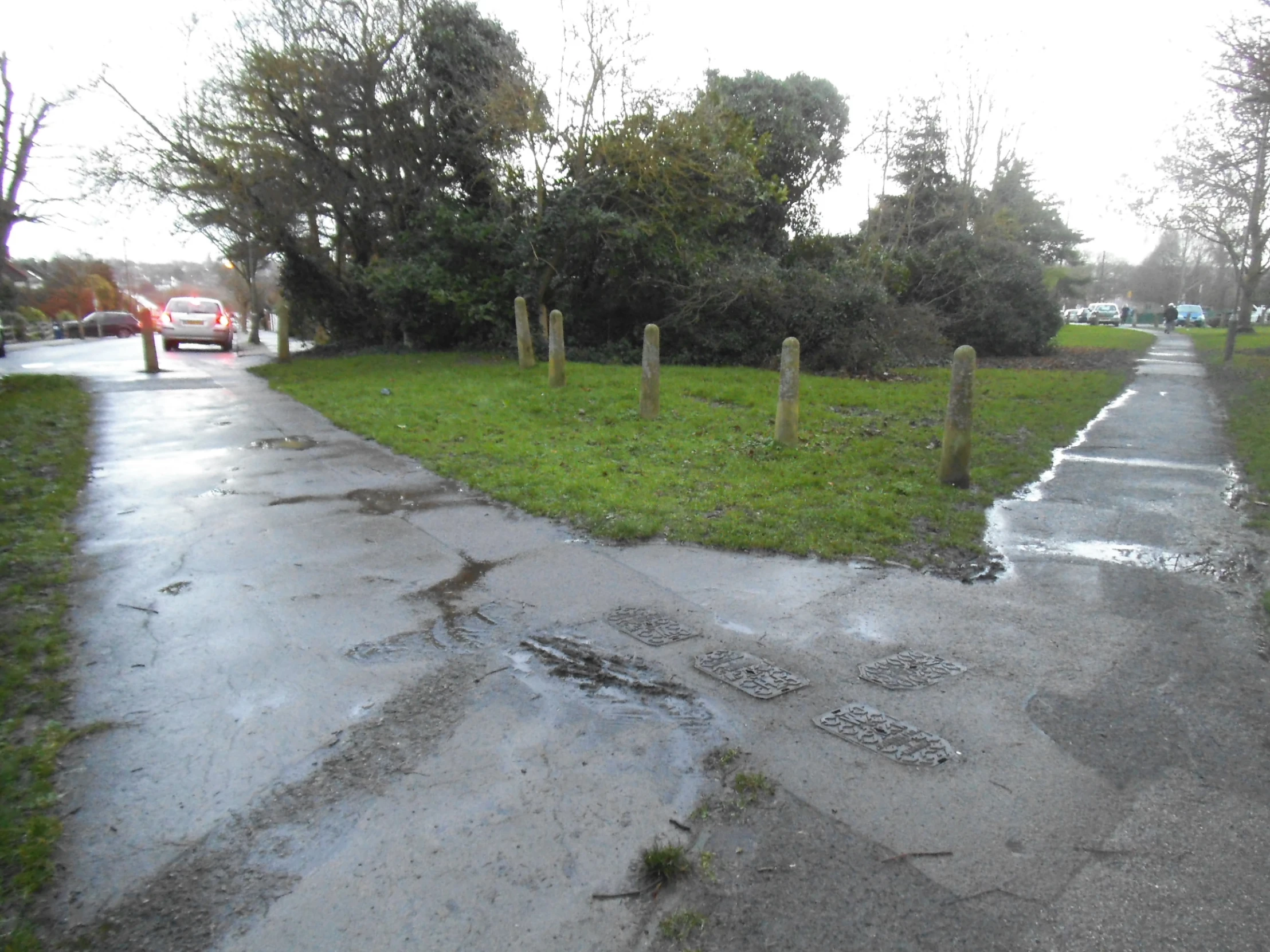 an old, deserted street with a grass area