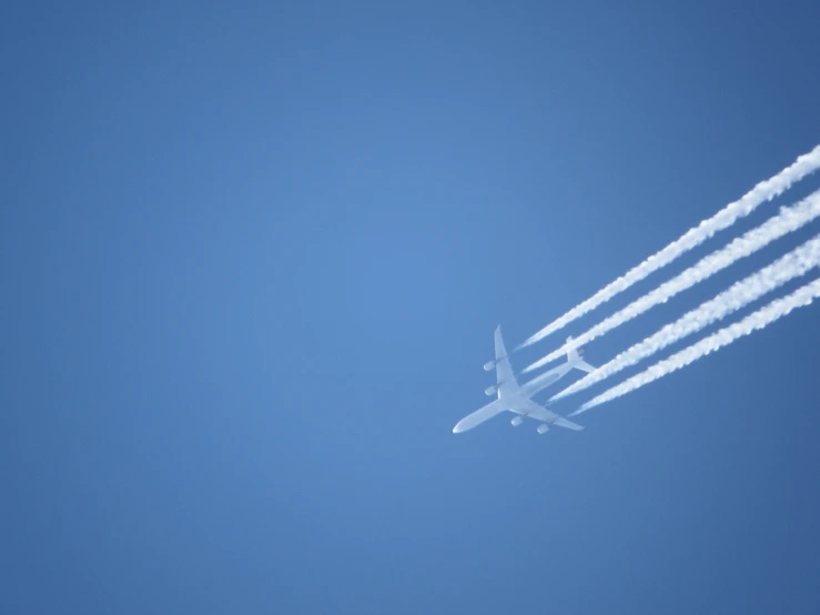 four jet planes flying in formation into the sky