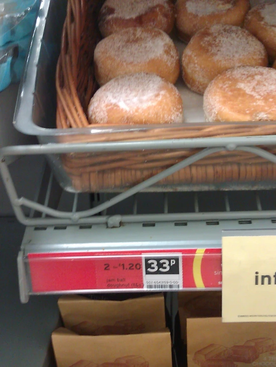 doughnuts in a basket sit on a shelf