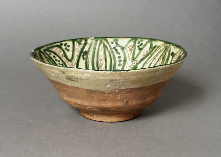 a bowl with two different types of designs in it