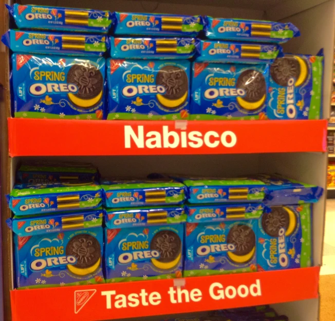a shelf of oreo snacks sitting in a grocery store