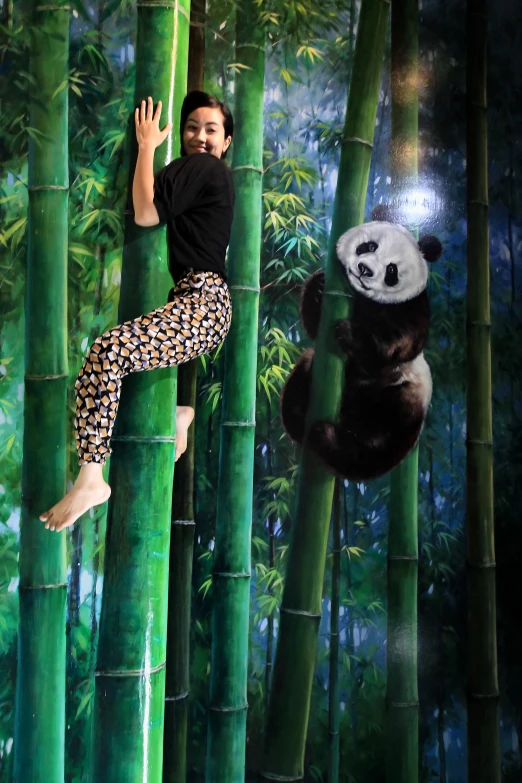 a child riding a zip in the air between bamboo trees