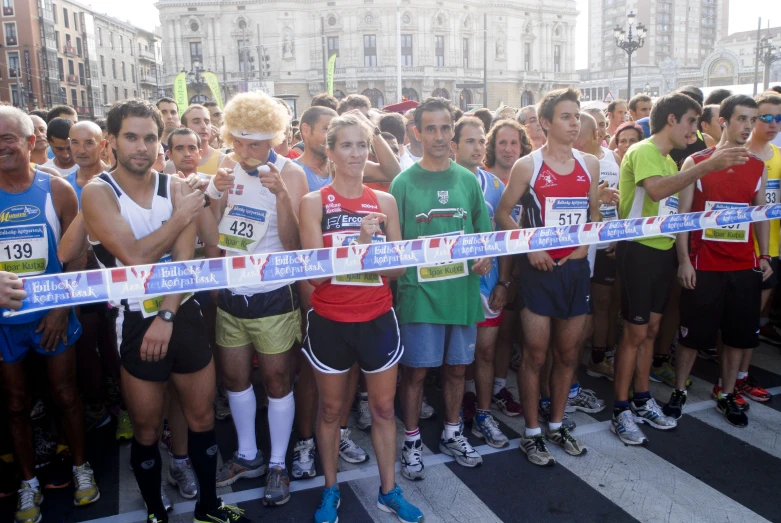 there are many people gathered at the finish line