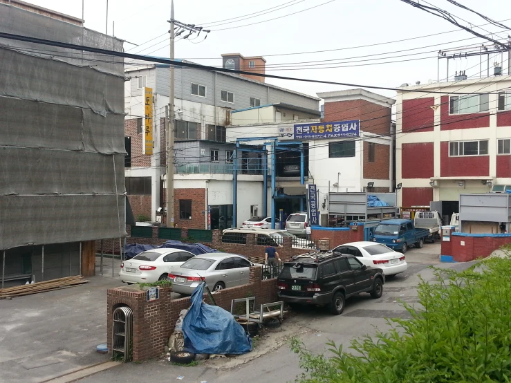 some cars parked next to each other on the street