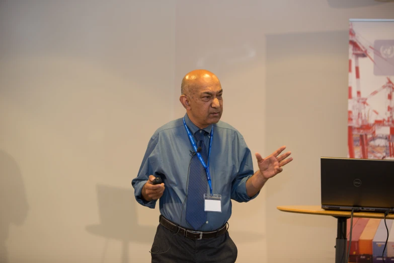 the man is talking while in front of the computer