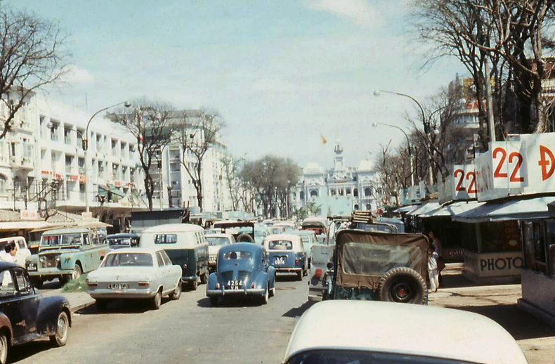 cars on the street near a shopping center