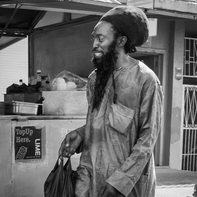 a man walking down the street in an african style