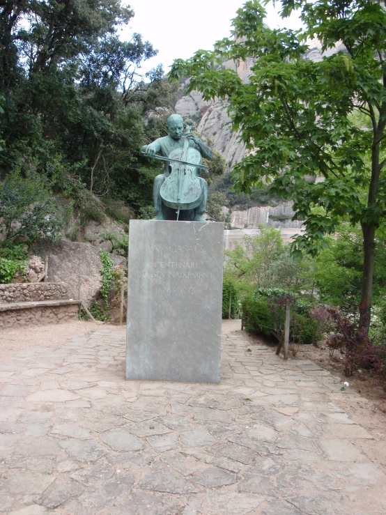 a statue of a woman stands behind another statue