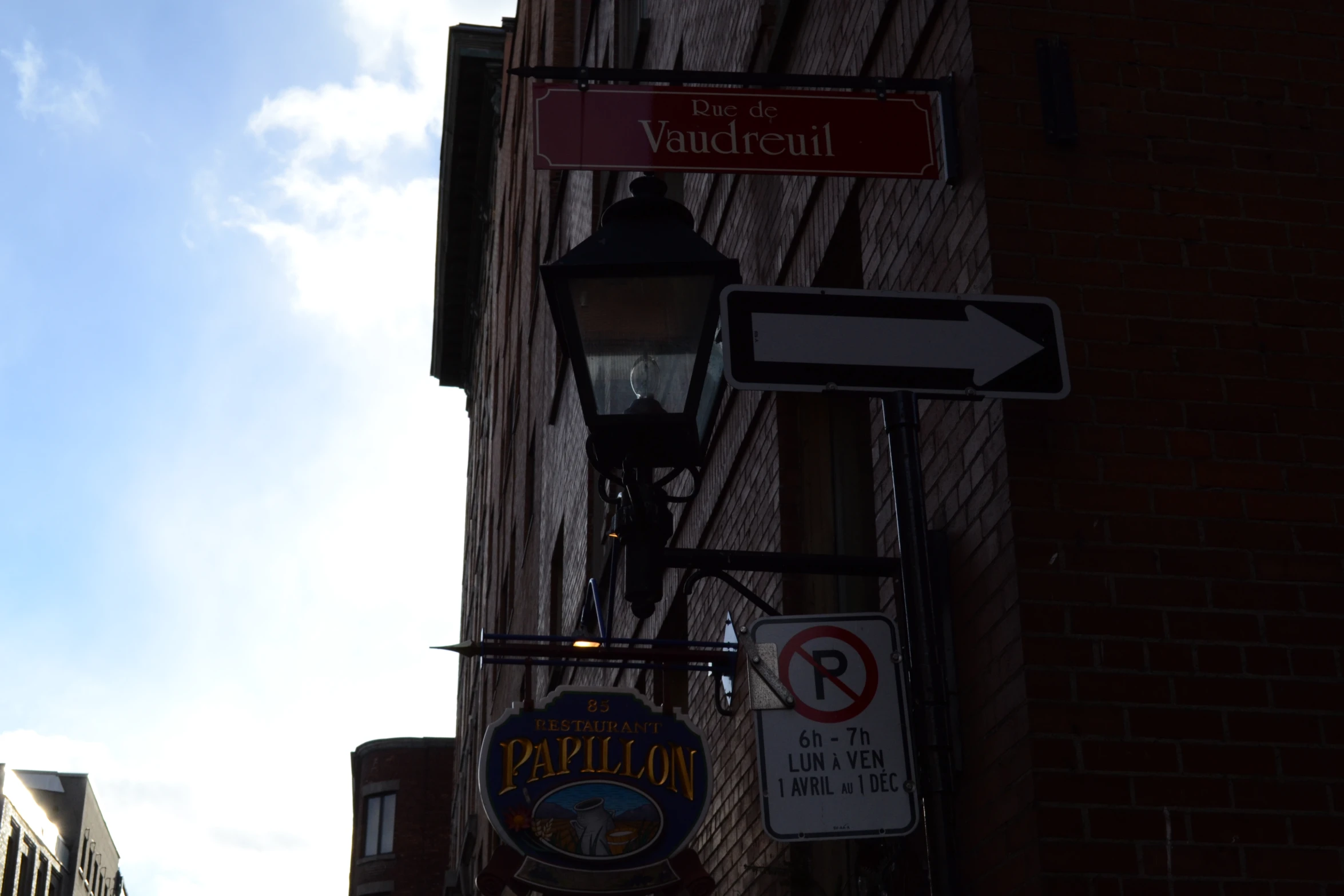 signs on the corner of a building in downtown