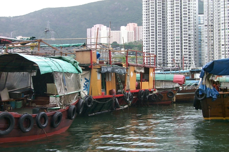 the boats are tied up by the dock