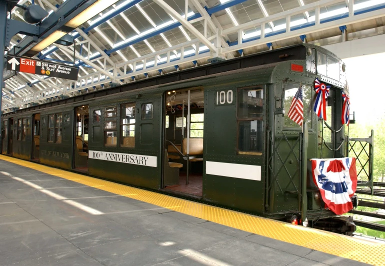 an abandoned train car with the door open at a depot