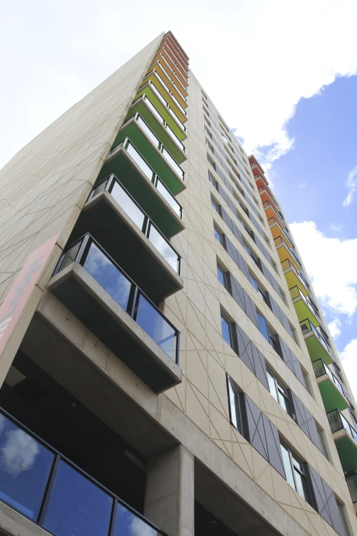 a tall building with different windows on the sides