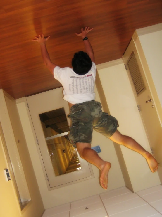 a man is jumping high over a counter