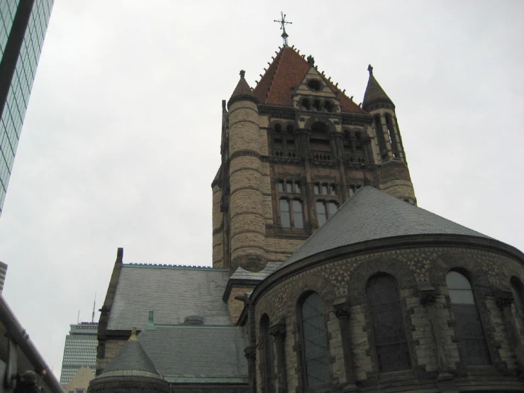 a po taken from below of the steeple and the roof of some buildings