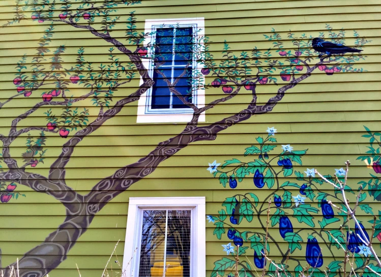 the wall is painted with a tree and window