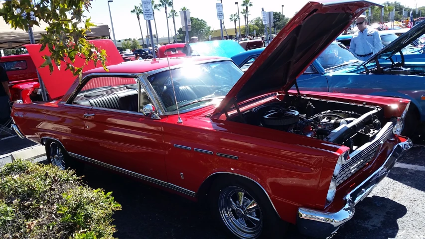 a old, antique car with its hood open